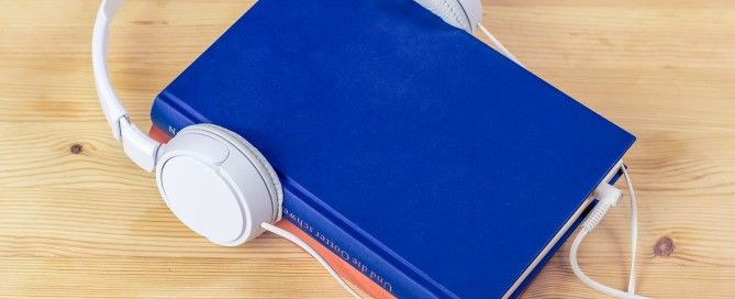 image of book with headphones