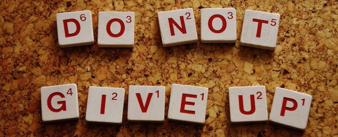 Scrabble tiles with text that says do not give up