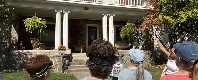 Image of people looking at a historic house.