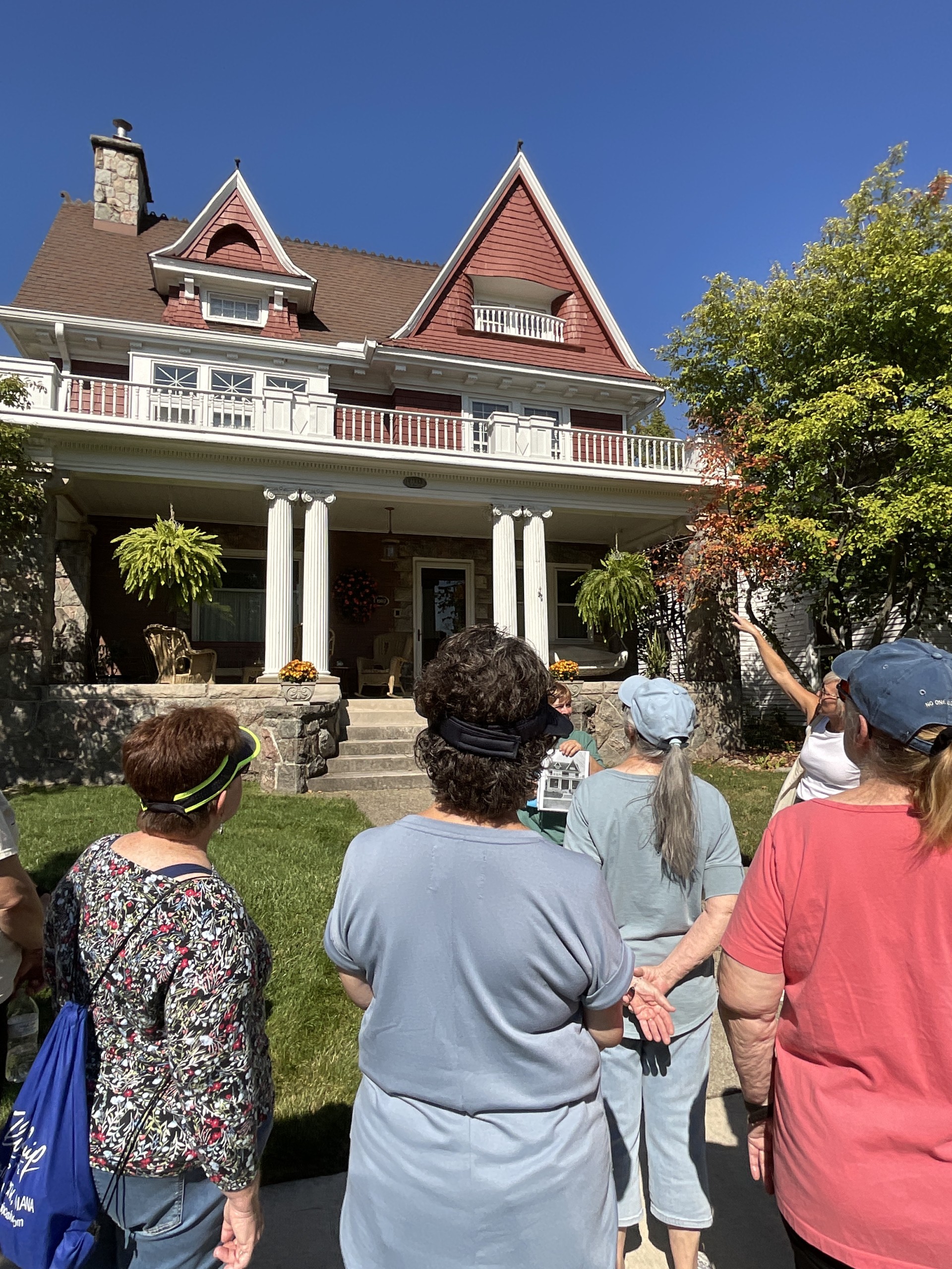 Image of people looking at a historic house.
